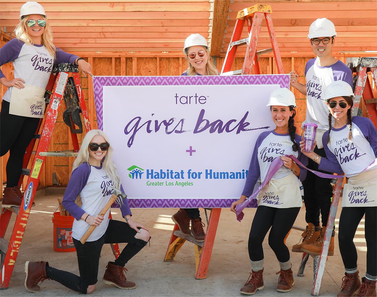 a group of tarte employyes volunteering at Habitat for Humanity